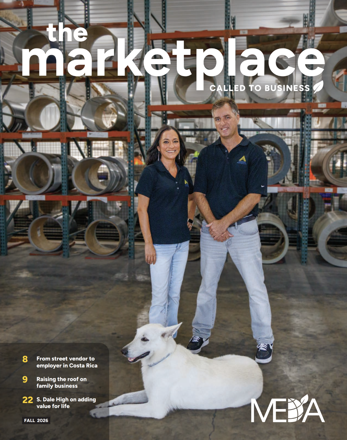 Magazine cover: two people in a warehouse among ductwork, with a white dog at their feet and the title 'the marketplace' overlaid.